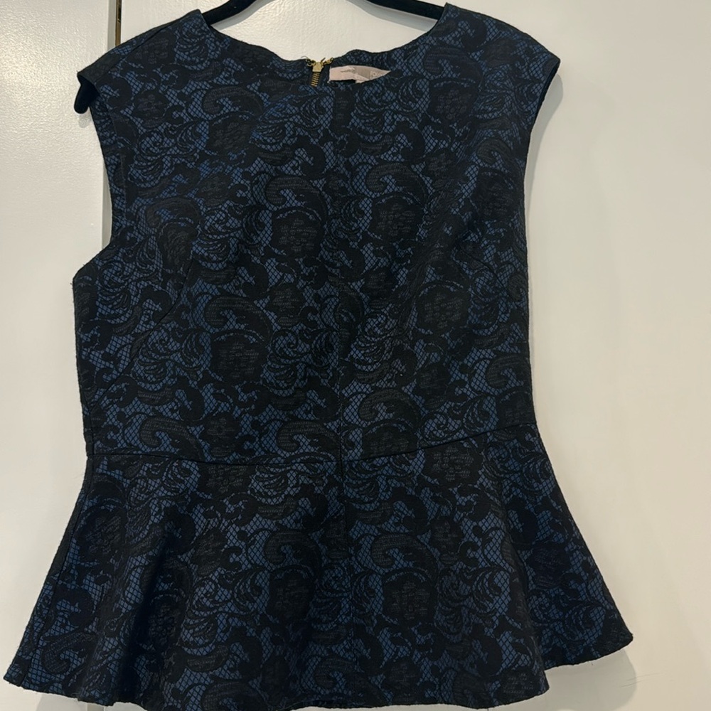 Beautiful women’s peplum top. Size Large. Used. Forever 21.